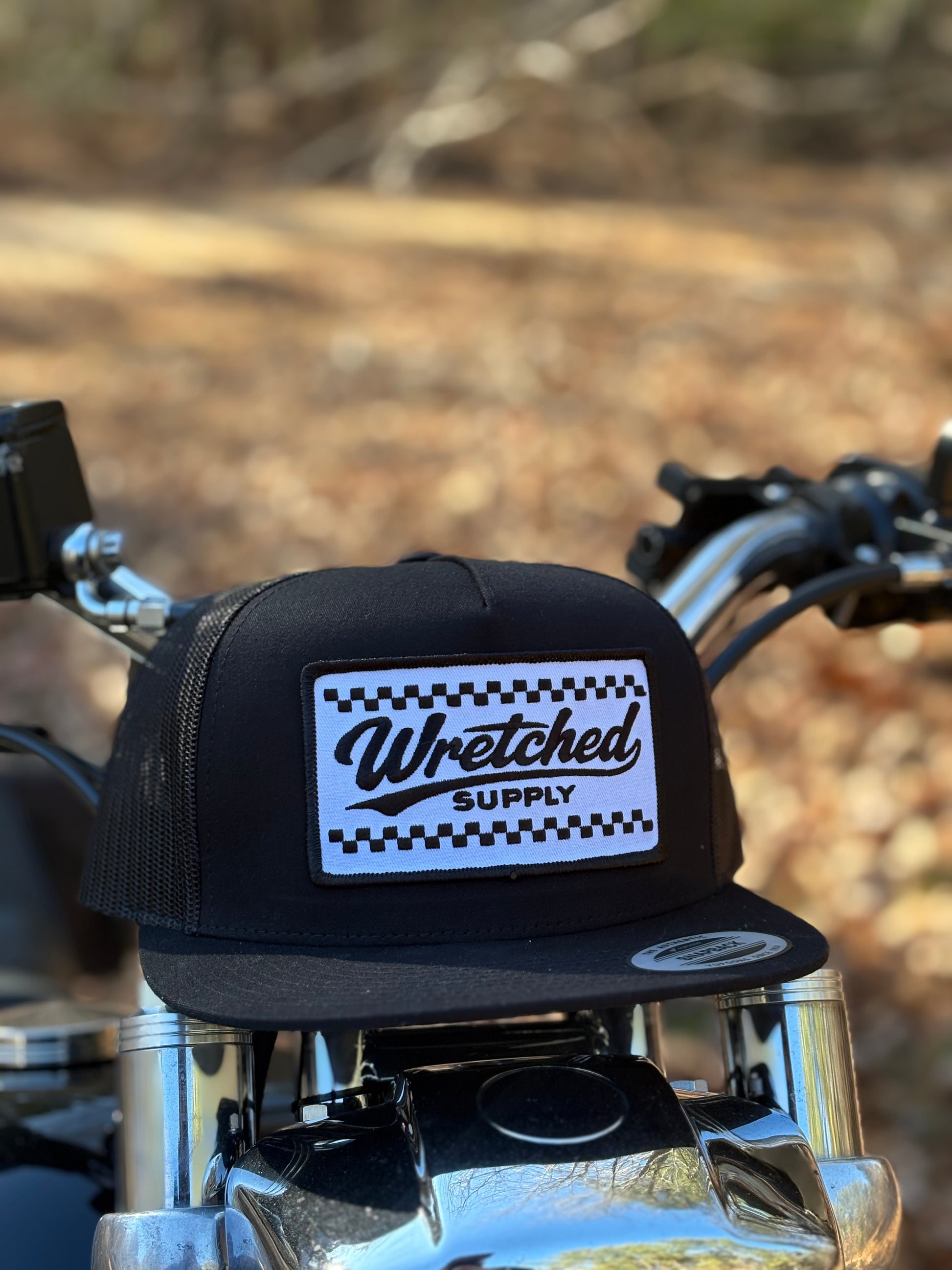Black checkerboard patch hat