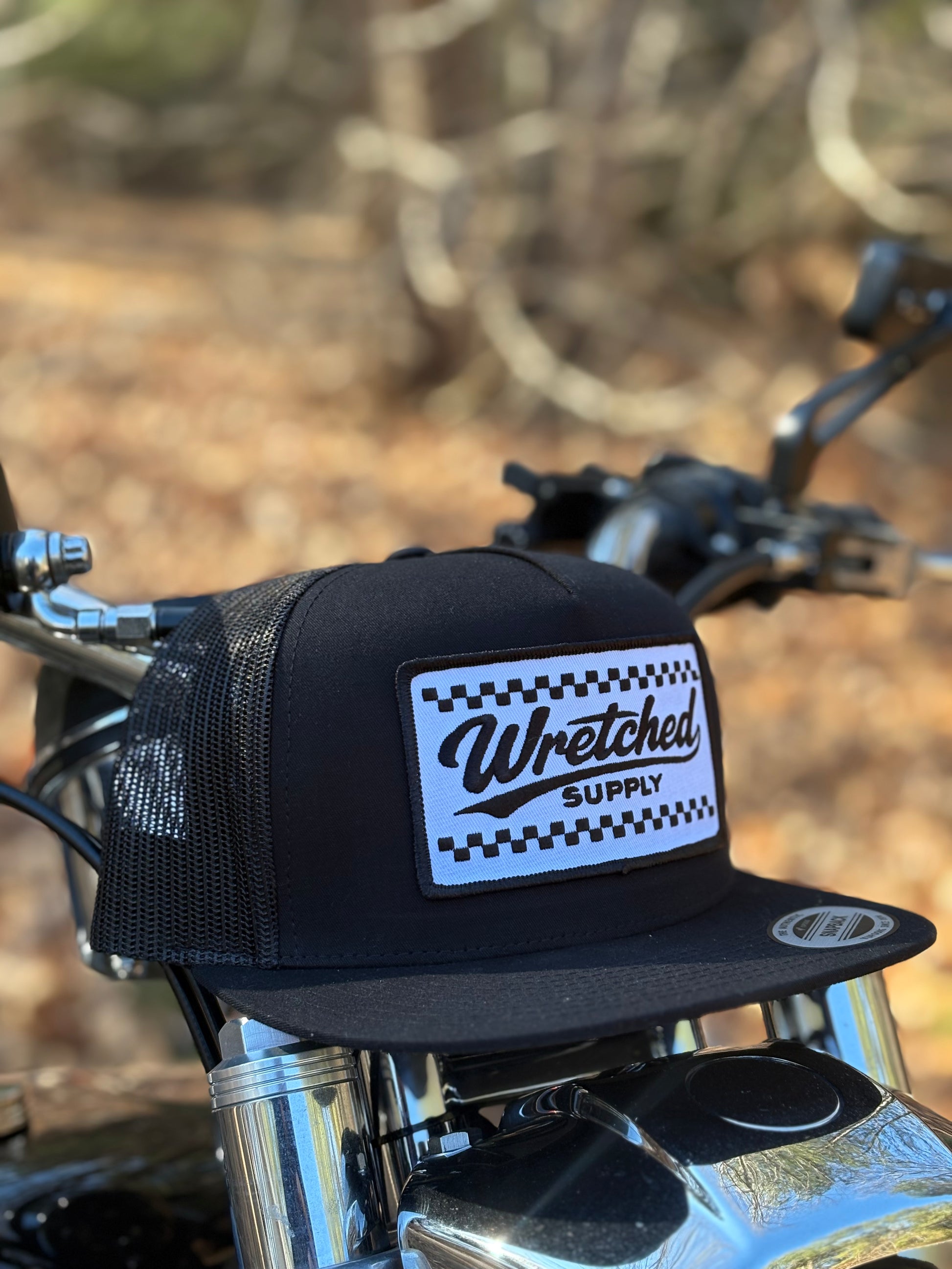 Black checkerboard patch hat