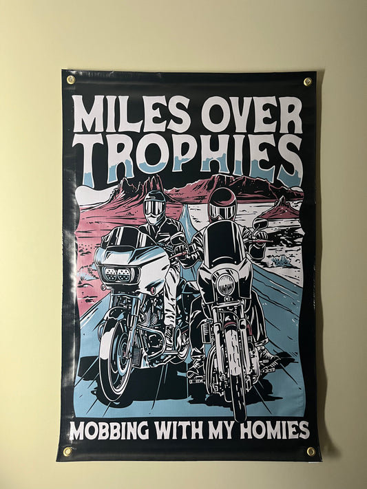 Miles over trophies banner